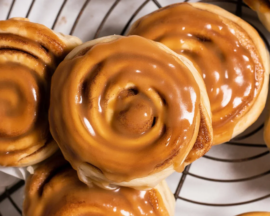 Dairy free caramel apple cookies topped with caramel and fresh apples.