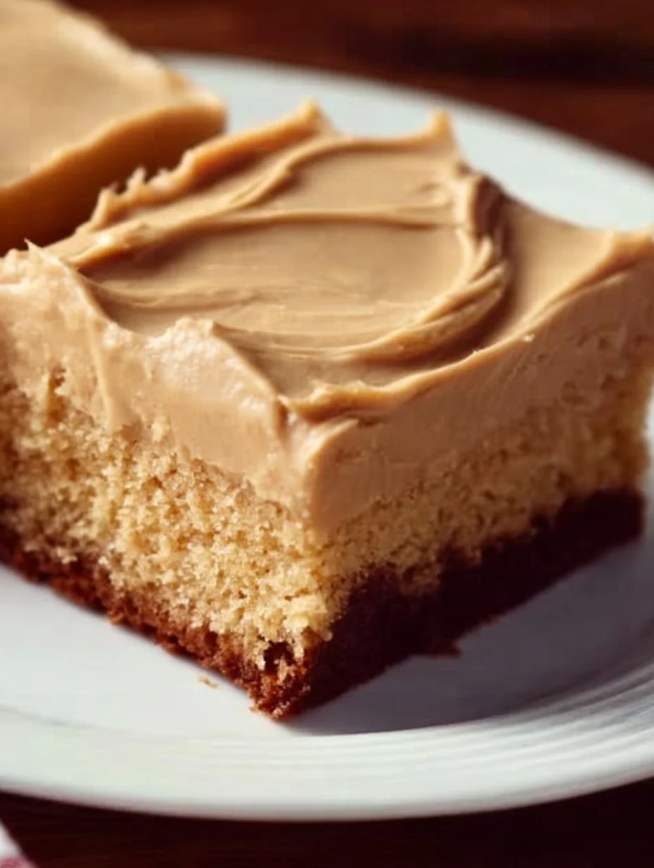 Delicious peanut butter sheet cake topped with creamy peanut butter frosting.