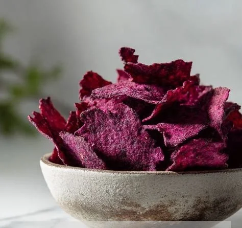 Plate of crispy beet crackers with a vibrant color and crunchy texture