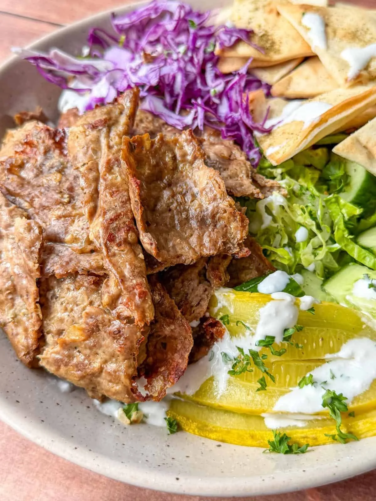 Homemade doner kebab served with fresh vegetables and sauces