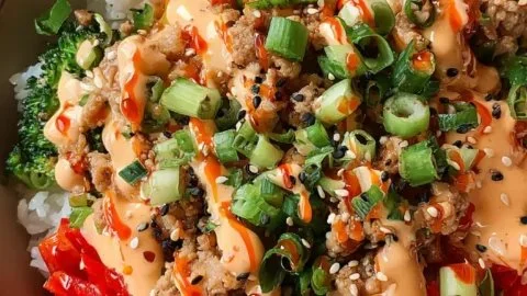 Bang Bang Ground Turkey Rice Bowls with colorful vegetables served in a bowl.